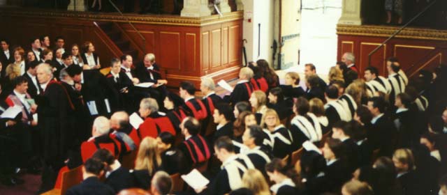 Students seated in hall.